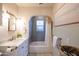 Bright bathroom with a vanity, tub/shower, and classic tile flooring at 537 W Encanto Blvd, Phoenix, AZ 85003