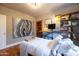 Bright bedroom with a large bed, desk, and bookshelf, adorned with modern art at 537 W Encanto Blvd, Phoenix, AZ 85003