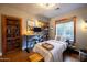 Cozy bedroom with a desk, shelves, and large window offering ample natural light at 537 W Encanto Blvd, Phoenix, AZ 85003