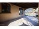 Carport with wrought iron gate, stucco walls and decorative windows at 537 W Encanto Blvd, Phoenix, AZ 85003