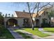 Beautiful home with lush landscaping, an arched driveway, and a welcoming front exterior at 537 W Encanto Blvd, Phoenix, AZ 85003