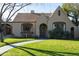 Charming home with a well-manicured lawn, inviting walkway, and classic architectural details at 537 W Encanto Blvd, Phoenix, AZ 85003