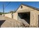 View of the garage with open door and long private drive at 537 W Encanto Blvd, Phoenix, AZ 85003