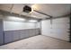 Spacious garage with painted walls, storage cabinets and roll-up door at 537 W Encanto Blvd, Phoenix, AZ 85003