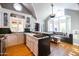 Well-lit kitchen with custom cabinetry, a vaulted ceiling, and a cozy window seat at 537 W Encanto Blvd, Phoenix, AZ 85003