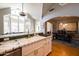 Sunlit kitchen featuring farmhouse sink, white tile countertop, and view of dining and sitting area at 537 W Encanto Blvd, Phoenix, AZ 85003