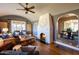 Inviting living room with a cozy fireplace, hardwood floors, and an open archway to dining at 537 W Encanto Blvd, Phoenix, AZ 85003