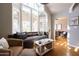 Bright living room features a cozy window seat and hardwood floors at 537 W Encanto Blvd, Phoenix, AZ 85003