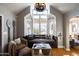 Bright living room features a cozy window seat and vaulted ceiling at 537 W Encanto Blvd, Phoenix, AZ 85003