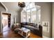 Cozy living room with a window seat, vaulted ceiling, and lots of natural light at 537 W Encanto Blvd, Phoenix, AZ 85003