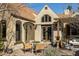 Charming outdoor patio with a dining table and comfortable wicker chairs, perfect for al fresco dining at 537 W Encanto Blvd, Phoenix, AZ 85003