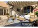 Inviting patio area with a pergola, comfortable seating, and stylish outdoor decor for relaxing at 537 W Encanto Blvd, Phoenix, AZ 85003