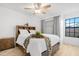 A bedroom with wood-look floors, ceiling fan, and large bed featuring brown wooden furniture at 5421 W Brown St, Glendale, AZ 85302