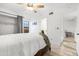 A bedroom with wood-look floors, ceiling fan, and a comfortable bed featuring brown wooden furniture at 5421 W Brown St, Glendale, AZ 85302