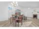 Open concept dining room features wood-look flooring at 5421 W Brown St, Glendale, AZ 85302