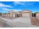 Desert home features a tile roof, a two car garage and gated, private front courtyard at 5421 W Brown St, Glendale, AZ 85302