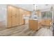 Kitchen with wood floors and cabinets shows ample storage and granite counters at 5421 W Brown St, Glendale, AZ 85302