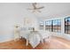 Bright main bedroom boasts tiled floor, ceiling fan, and big windows at 5421 W Brown St, Glendale, AZ 85302