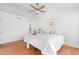 Bright main bedroom features tiled floor, ceiling fan, and large windows at 5421 W Brown St, Glendale, AZ 85302