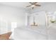 Bright and airy main bedroom shows tiled floors, ceiling fan, and modern design at 5421 W Brown St, Glendale, AZ 85302