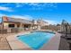 Backyard pool featuring desert landscaping, covered patio with solar panels at 5421 W Brown St, Glendale, AZ 85302