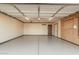 Spacious, clean garage with epoxy flooring, ample lighting, and pegboard wall storage system at 5603 W Bluefield Ave, Glendale, AZ 85308