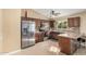 Well-equipped kitchen featuring stainless steel appliances, tile backsplash, and ample counter space at 5603 W Bluefield Ave, Glendale, AZ 85308