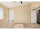 A main bedroom with wood-look tile flooring, a ceiling fan, and an ensuite bathroom at 5603 W Bluefield Ave, Glendale, AZ 85308