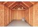 Empty shed with high ceiling, wood construction and concrete floors at 5603 W Bluefield Ave, Glendale, AZ 85308