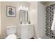 Clean bathroom with white vanity, patterned shower, and updated fixtures at 6201 W Maryland Ave, Glendale, AZ 85301