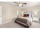 Cozy bedroom featuring a comfortable bed, ceiling fan, and neutral color palette at 6201 W Maryland Ave, Glendale, AZ 85301