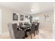 Elegant dining room with a dark wood table and gray chairs at 6201 W Maryland Ave, Glendale, AZ 85301