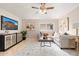 Spacious living room with L-shaped sofa, large TV, and decorative accents at 6201 W Maryland Ave, Glendale, AZ 85301