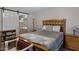 Bedroom with a barn door leading to a private bathroom at 6871 S Coral Gable Dr, Chandler, AZ 85249