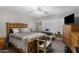 Cozy bedroom with wood bed frame and a dresser at 6871 S Coral Gable Dr, Chandler, AZ 85249