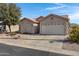 House exterior showcasing a two-car garage and well-maintained yard at 6871 S Coral Gable Dr, Chandler, AZ 85249