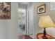 Hallway with a view into a bedroom and a table lamp at 6871 S Coral Gable Dr, Chandler, AZ 85249