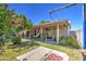 Relaxing backyard patio with covered seating area and grassy yard at 7201 W Alvarado Rd, Phoenix, AZ 85035