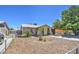 Tan single story home with a spacious yard and mature tree at 7201 W Alvarado Rd, Phoenix, AZ 85035