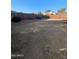 Sunny backyard with grass and small fountain at 7417 W Park St, Laveen, AZ 85339