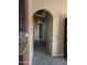 Home hallway with archways leading to bedrooms and bathrooms at 7417 W Park St, Laveen, AZ 85339