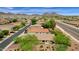 Aerial view of a house with a landscaped yard and neighborhood streets visible at 7635 W Rock Springs Dr, Peoria, AZ 85383