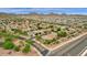 Aerial view of a residential neighborhood with houses and mountain views at 7635 W Rock Springs Dr, Peoria, AZ 85383