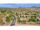 Aerial view showing a community of houses nestled in a desert landscape at 7635 W Rock Springs Dr, Peoria, AZ 85383