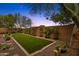 Landscaped backyard with artificial turf and trellises at 7635 W Rock Springs Dr, Peoria, AZ 85383