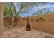 Charming backyard with fire pit and brick patio at 7635 W Rock Springs Dr, Peoria, AZ 85383