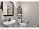 Powder room with pedestal sink and shelving at 7635 W Rock Springs Dr, Peoria, AZ 85383