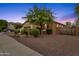 Side view of a house with stone accents and desert landscaping at 7635 W Rock Springs Dr, Peoria, AZ 85383