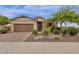 House exterior with a brown garage door and nicely landscaped front yard at 7635 W Rock Springs Dr, Peoria, AZ 85383