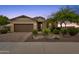 Single-story home with a two-car garage and landscaped front yard at 7635 W Rock Springs Dr, Peoria, AZ 85383